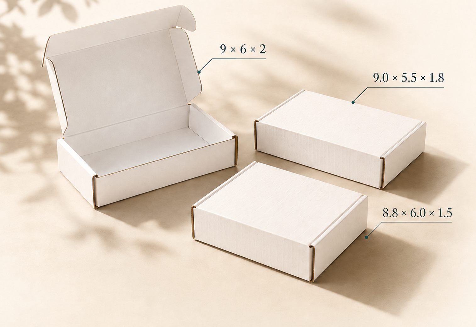 Three white mailer boxes labeled 9 by 6 by 2 inches, 9.0 by 5.5 by 1.8 inches, and 8.8 by 6.0 by 1.5 inches